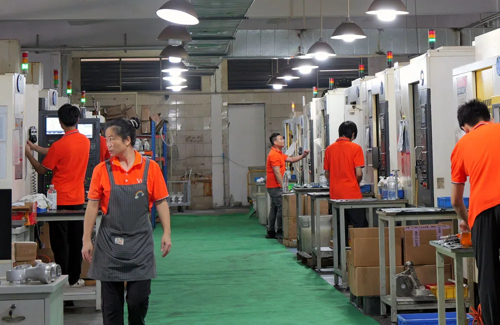 VOGUC production team operating CNC machines